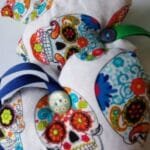 Colourful skulls on white heart background - pic 6