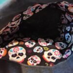 Black gift bag with colourful skulls lining - pic 1