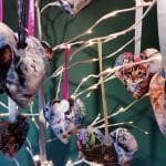 Collection of kitten faces on hearts hanging from artificial tree - pic 1