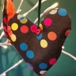 Colourful polka dots on black heart - pic 1