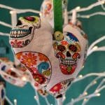 Colourful skulls on white heart background - pic 2