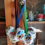 Colourful skulls on white heart background - pic 1